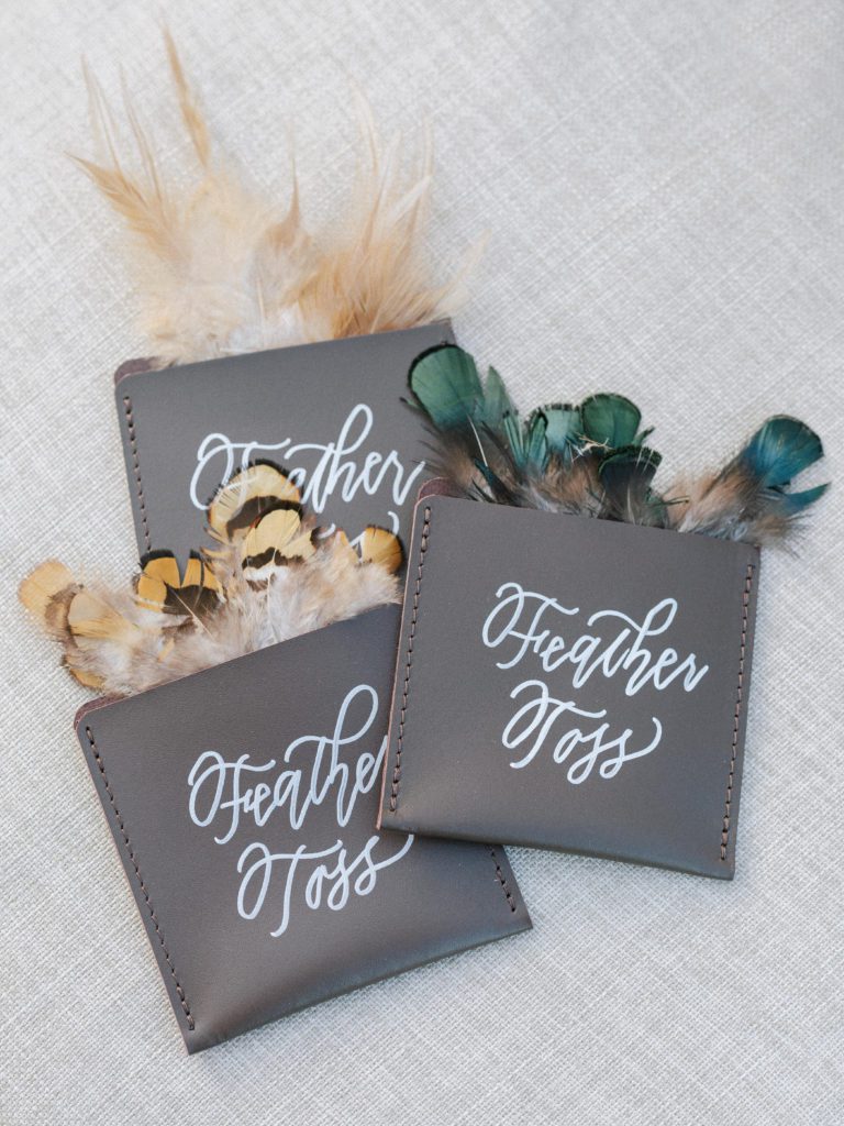 wedding details, autumn wedding, autumn wedding decor, wedding feathers, feather toss, wedding ceremony send-off